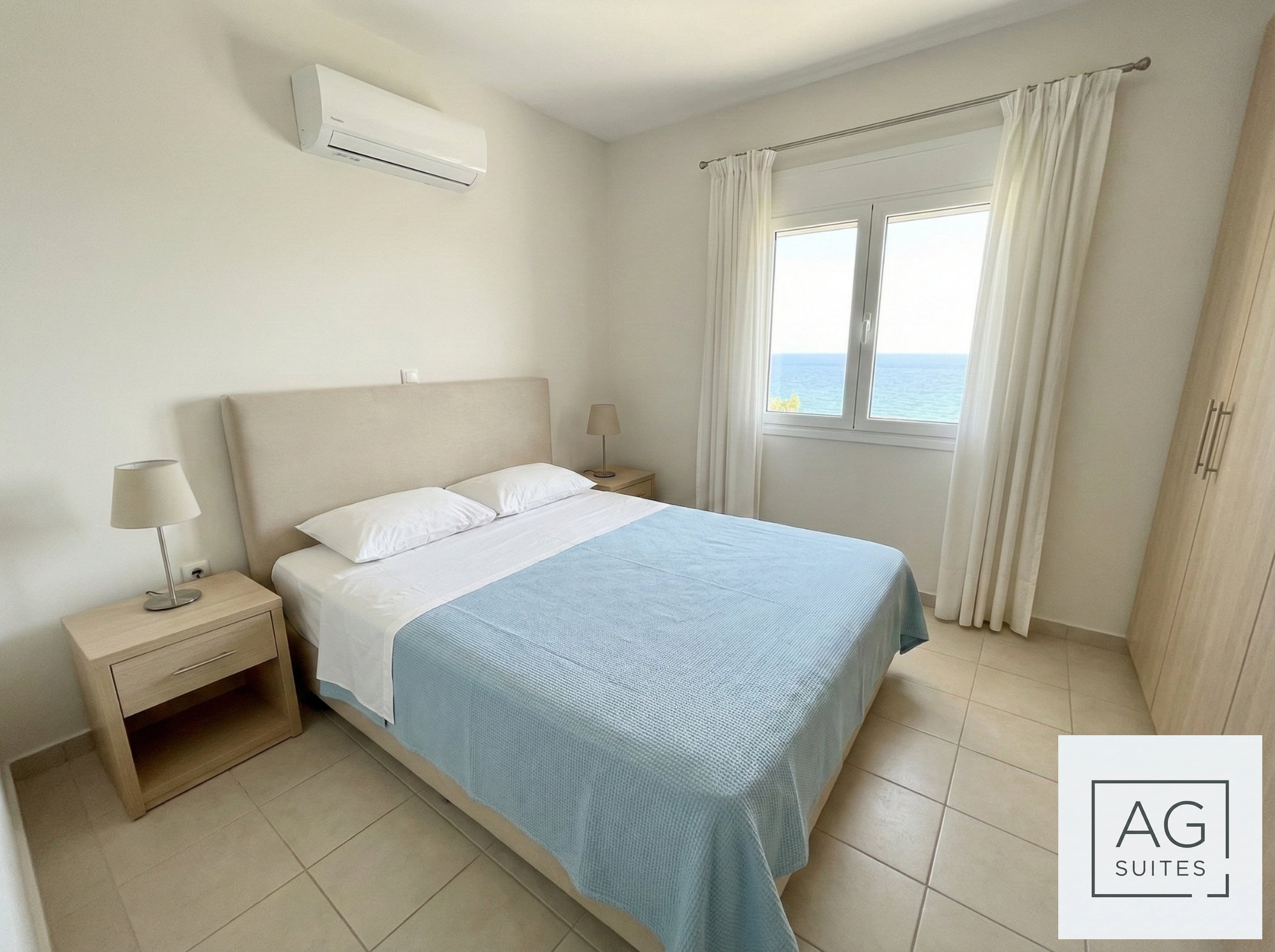 Bay View Prestige Apartment master bedroom with sea view